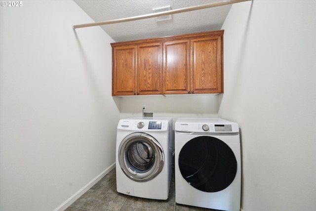 13733 NW Trevino St, Portland, OR 97229 - washroom featuring washer and dryer, cabinet space, baseboards, and a textured ceiling