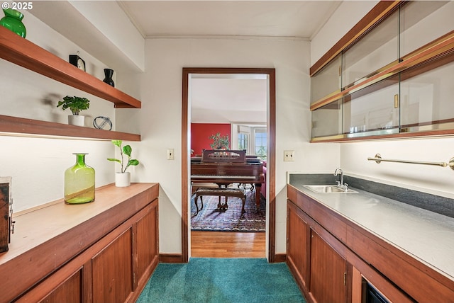 4317 SW Bernard Dr, Portland, OR 97239 - bar featuring a sink, dark colored carpet, and baseboards