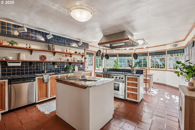 4317 SW Bernard Dr, Portland, OR 97239 - kitchen featuring stainless steel appliances, island range hood, plenty of natural light, and a center island