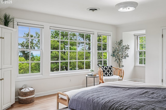 4317 SW Bernard Dr, Portland, OR 97239 - bedroom featuring wood finished floors and baseboards