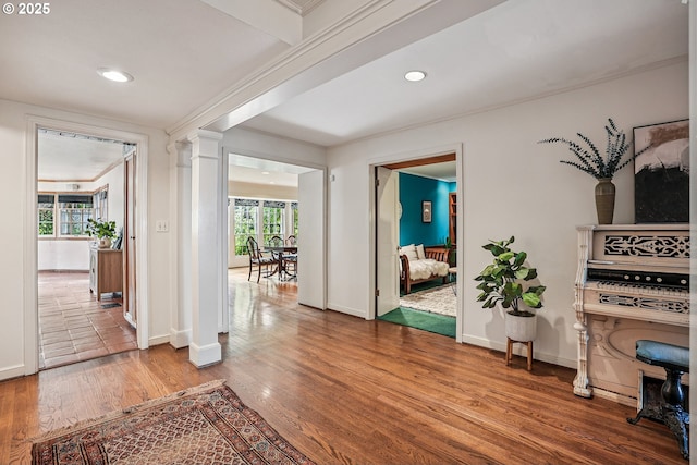 4317 SW Bernard Dr, Portland, OR 97239 - corridor featuring wood finished floors, recessed lighting, baseboards, decorative columns, and crown molding