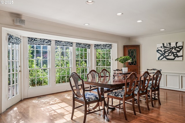 4317 SW Bernard Dr, Portland, OR 97239 - dining space with ornamental molding, plenty of natural light, recessed lighting, wood finished floors, and a wainscoted wall