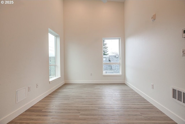 spare room featuring light wood-type flooring