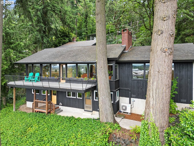 275 Sunset Dr, Eugene, OR 97403 - rear view of property featuring a chimney, a balcony, and roof with shingles