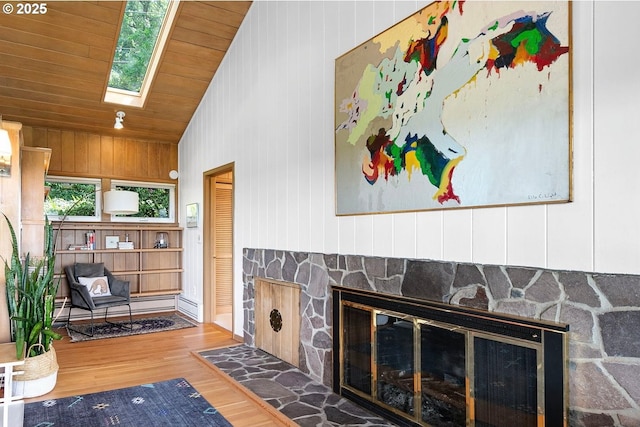 275 Sunset Dr, Eugene, OR 97403 - living room with a skylight, a stone fireplace, wood finished floors, and wooden ceiling
