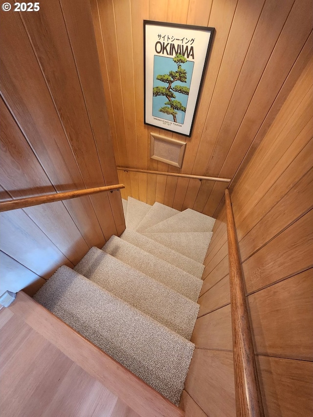 275 Sunset Dr, Eugene, OR 97403 - staircase featuring wood walls, wood ceiling, and wood finished floors