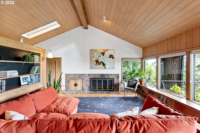 275 Sunset Dr, Eugene, OR 97403 - living area featuring a skylight, a fireplace, wood walls, wood finished floors, and wood ceiling
