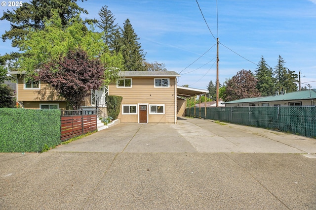 view of front of home with fence and driveway