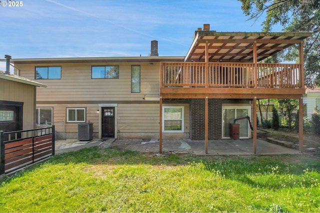 back of house featuring a lawn, a deck, a patio area, central AC, and a pergola