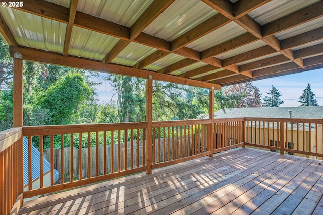 wooden terrace featuring a water view