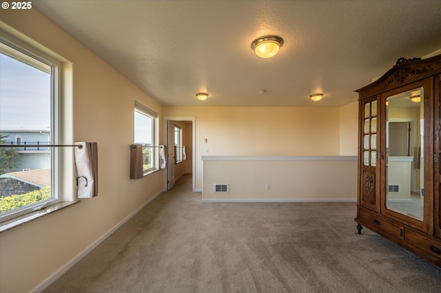 757 Newport Ave SW, Bandon, OR 97411 - carpeted empty room featuring baseboards and visible vents
