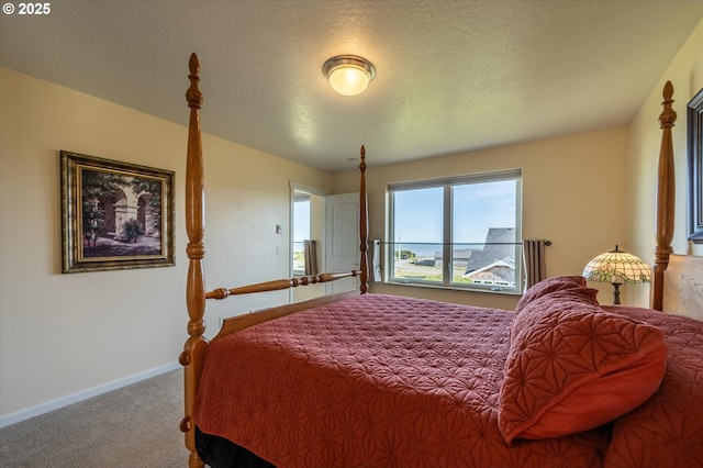 757 Newport Ave SW, Bandon, OR 97411 - carpeted bedroom featuring baseboards and a textured ceiling