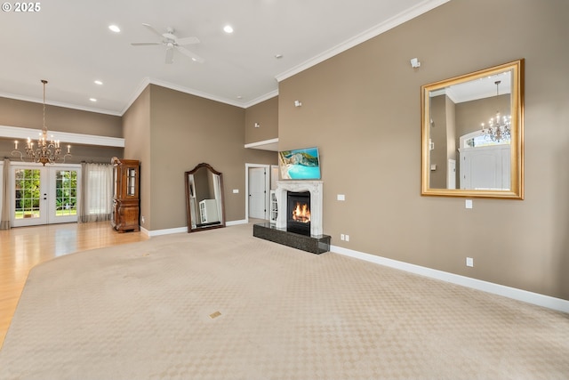 245 Winchester Creek Ave, Winchester, OR 97495 - unfurnished living room featuring a chandelier, crown molding, recessed lighting, a glass covered fireplace, and a ceiling fan
