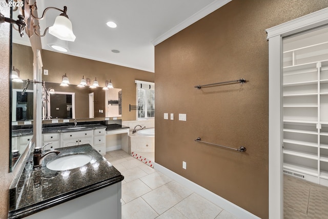full bathroom featuring tile patterned floors, a garden tub, vanity, a walk in closet, and baseboards