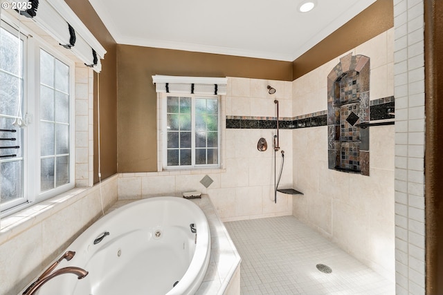 bathroom with a jetted tub, a tile shower, and ornamental molding
