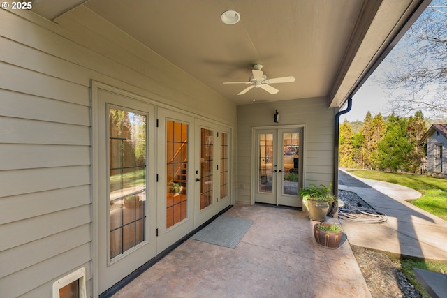 view of patio with french doors and a ceiling fan