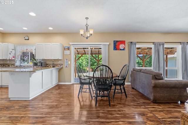 2855 NW Orchard Heights Ave, Albany, OR 97321 - dining room with wood finished floors, recessed lighting, baseboards, and a chandelier