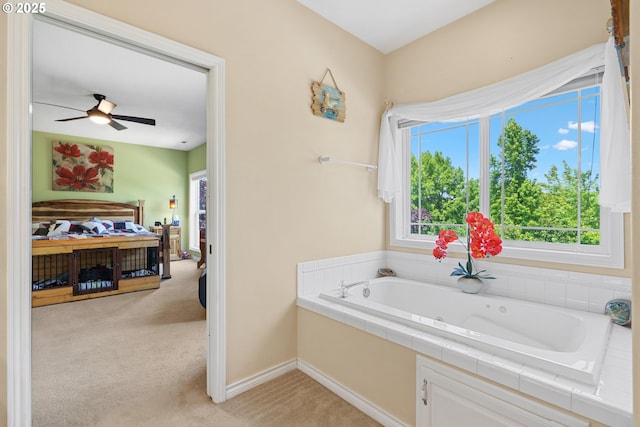 2855 NW Orchard Heights Ave, Albany, OR 97321 - bathroom featuring a whirlpool tub, ceiling fan, and baseboards