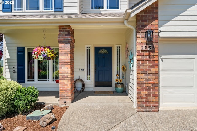 2855 NW Orchard Heights Ave, Albany, OR 97321 - doorway to property featuring brick siding, a porch, and a shingled roof