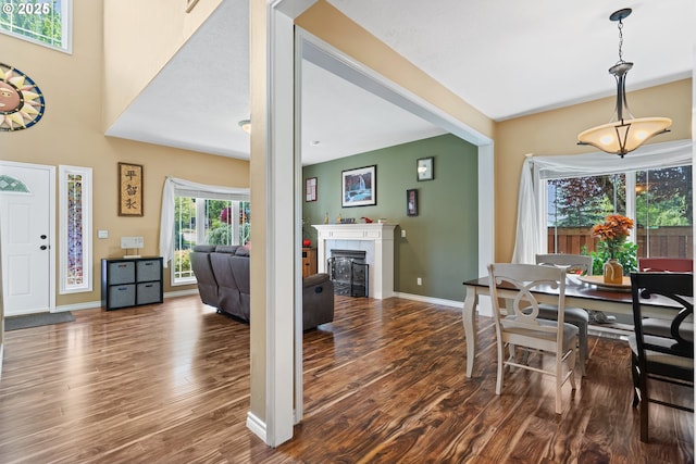 2855 NW Orchard Heights Ave, Albany, OR 97321 - dining space featuring wood finished floors, baseboards, and a tiled fireplace