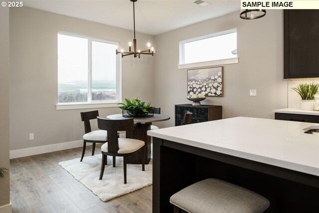 4688 NW 71st Ave, Camas, WA 98607 - kitchen featuring light countertops, appliances with stainless steel finishes, light wood-style floors, and decorative backsplash