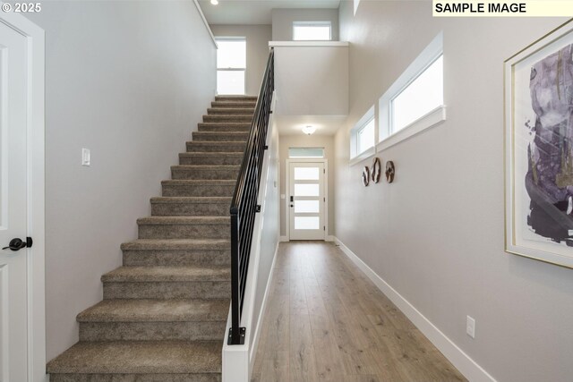 4688 NW 71st Ave, Camas, WA 98607 - unfurnished living room with light wood-style floors, recessed lighting, a fireplace, and stairway