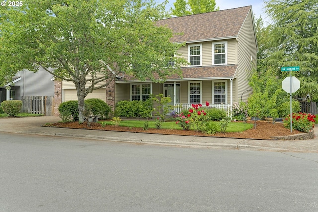 17811 NW Gilbert Ln, Portland, OR 97229 - traditional-style home with a porch, a shingled roof, concrete driveway, and a garage