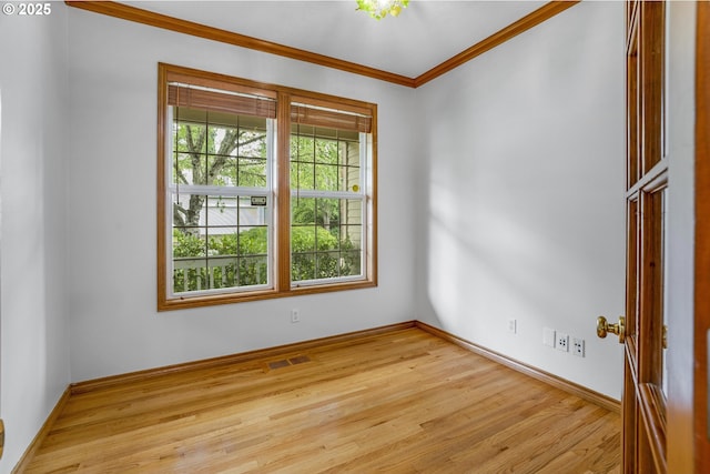 17811 NW Gilbert Ln, Portland, OR 97229 - empty room featuring wood finished floors, crown molding, and baseboards