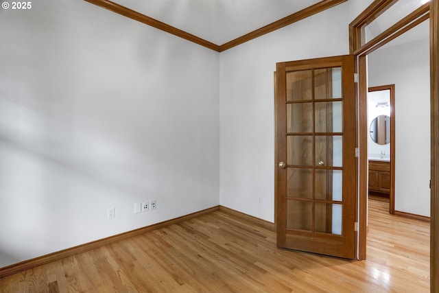 17811 NW Gilbert Ln, Portland, OR 97229 - spare room featuring crown molding, light wood-type flooring, and baseboards