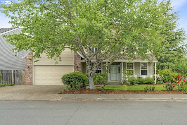 17811 NW Gilbert Ln, Portland, OR 97229 - view of property hidden behind natural elements featuring covered porch, concrete driveway, a garage, and brick siding