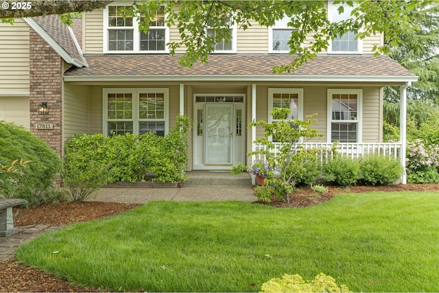 17811 NW Gilbert Ln, Portland, OR 97229 - view of front of house with a shingled roof, a front lawn, and covered porch