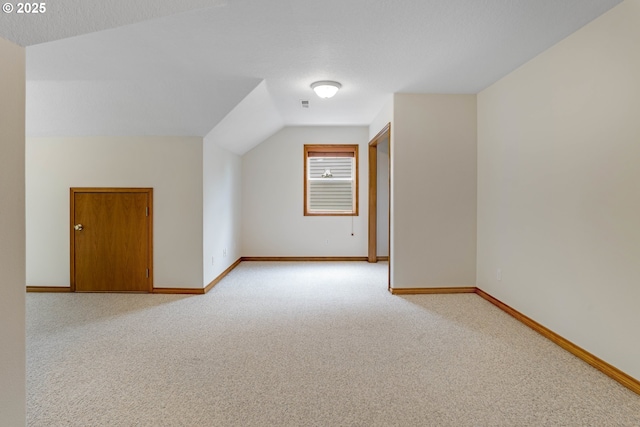 17811 NW Gilbert Ln, Portland, OR 97229 - bonus room featuring light carpet, baseboards, and vaulted ceiling