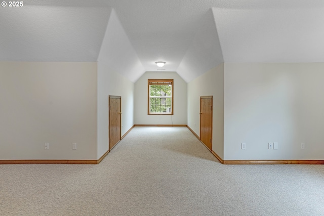 17811 NW Gilbert Ln, Portland, OR 97229 - additional living space with carpet flooring, lofted ceiling, and baseboards