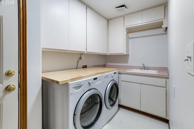 17811 NW Gilbert Ln, Portland, OR 97229 - laundry area featuring cabinet space and separate washer and dryer