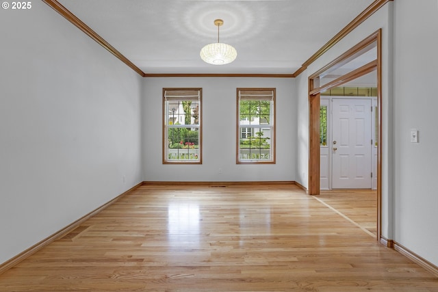 17811 NW Gilbert Ln, Portland, OR 97229 - spare room with crown molding, light wood-style flooring, and baseboards
