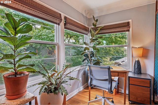 2025 SE Caruthers St Unit 19, Portland, OR 97214 - living area with wood finished floors, a fireplace, and baseboards