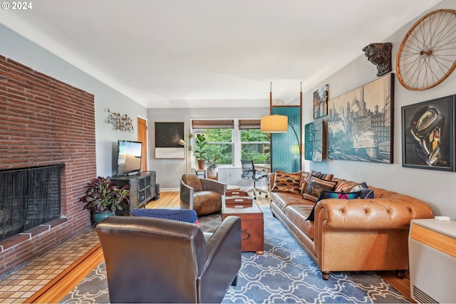 2025 SE Caruthers St Unit 19, Portland, OR 97214 - living room featuring wood finished floors and a fireplace