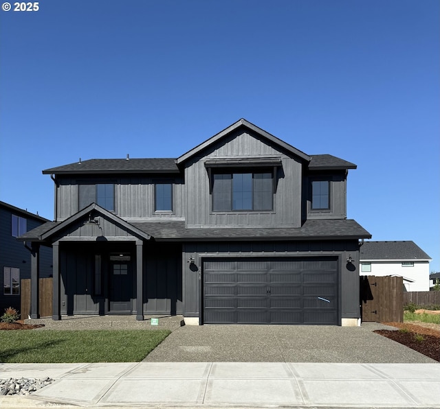 8208 NE 170th Ave, Vancouver, WA 98682 - view of front of house featuring fence, an attached garage, a shingled roof, and concrete driveway