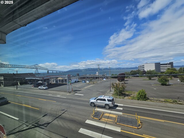 110 2nd St, Astoria, OR 97103 - view of asphalt road featuring a mountain view, sidewalks, and curbs
