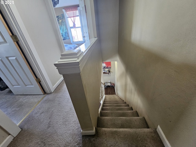 110 2nd St, Astoria, OR 97103 - staircase featuring carpet and baseboards