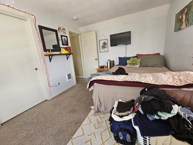 110 2nd St, Astoria, OR 97103 - carpeted bedroom featuring a textured ceiling