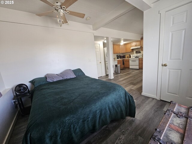 110 2nd St, Astoria, OR 97103 - bedroom featuring dark wood-style floors, beamed ceiling, separate washer and dryer, baseboards, and a ceiling fan