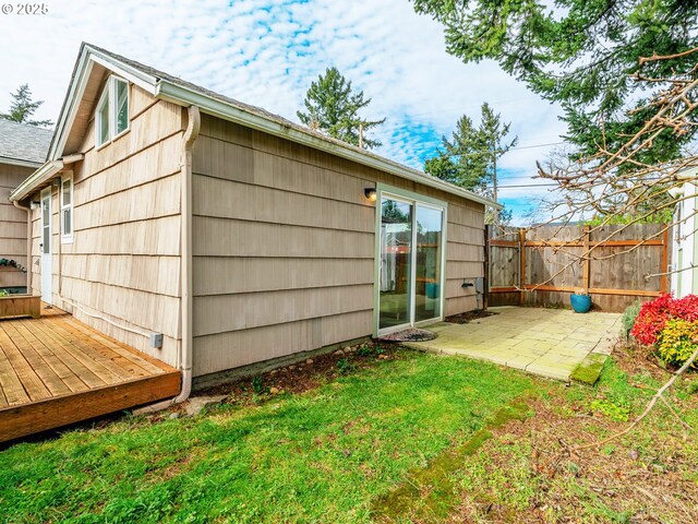 7644 SE Crystal Springs Blvd, Portland, OR 97206 - back of property featuring a patio and a deck