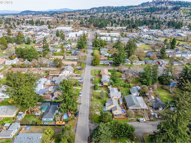 7644 SE Crystal Springs Blvd, Portland, OR 97206 - aerial view of property's location with nearby suburban area and a mountain backdrop