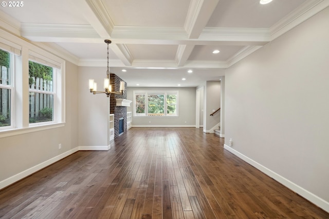 2760 SW Sylvania Ter, Portland, OR 97219 - unfurnished living room with dark wood-style floors, beam ceiling, stairway, coffered ceiling, and a chandelier