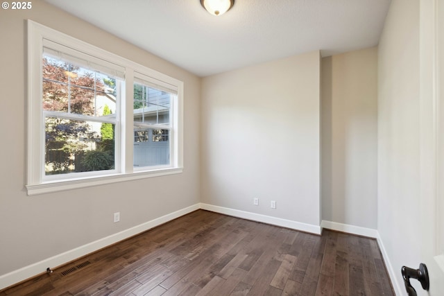 2760 SW Sylvania Ter, Portland, OR 97219 - spare room featuring dark wood-style flooring and baseboards
