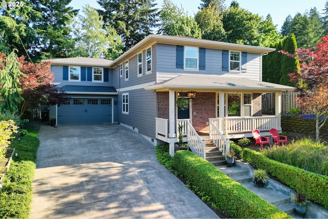 2760 SW Sylvania Ter, Portland, OR 97219 - view of front of house featuring driveway, a garage, a porch, and brick siding