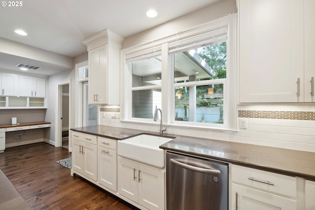 2760 SW Sylvania Ter, Portland, OR 97219 - kitchen with stainless steel dishwasher, dark countertops, decorative backsplash, recessed lighting, and white cabinets