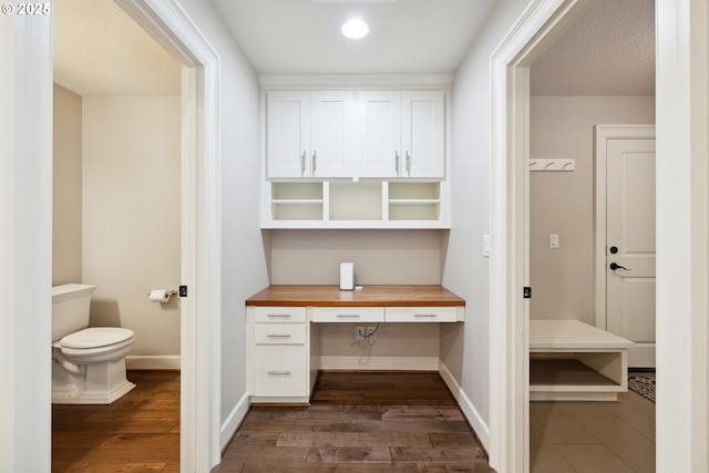 2760 SW Sylvania Ter, Portland, OR 97219 - unfurnished office with dark wood-style floors, built in desk, and recessed lighting