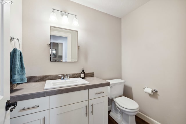 2760 SW Sylvania Ter, Portland, OR 97219 - bathroom featuring vanity and tasteful backsplash